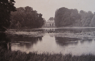 Photograph of house from the lake.